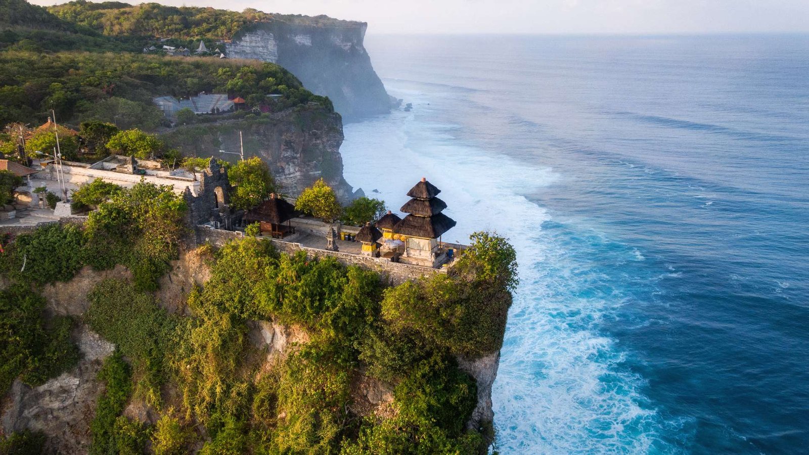 Stunning cliffside temple with panoramic ocean views, part of cultural Bali tour packages.